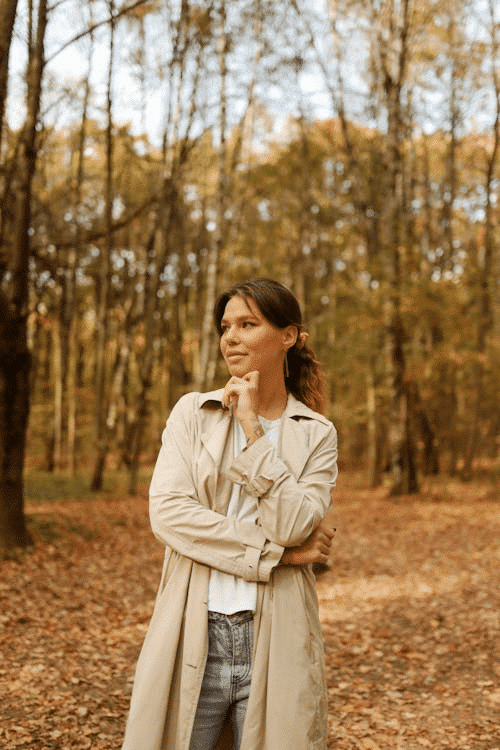 Woman smiling and contemplating in the woods